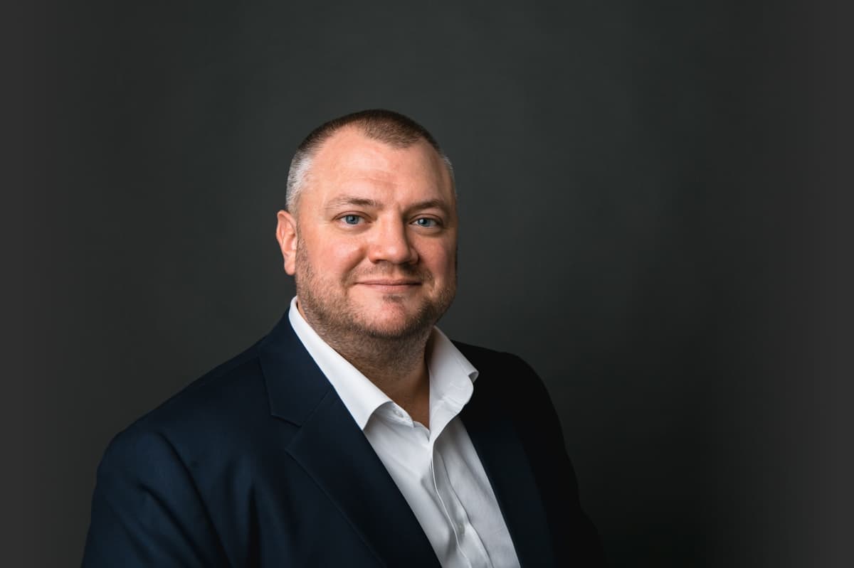 Iain Potter, damages expert and academic, seated professional portrait